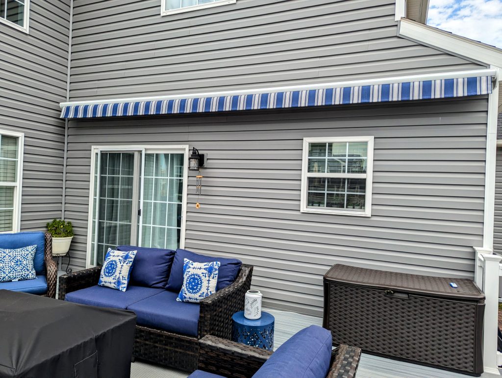 back porch with blue retractable awning