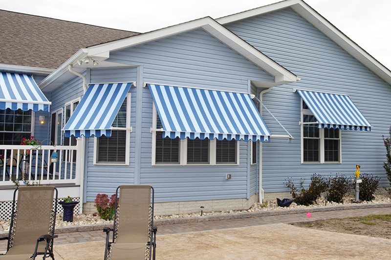 blue and white striped window awning